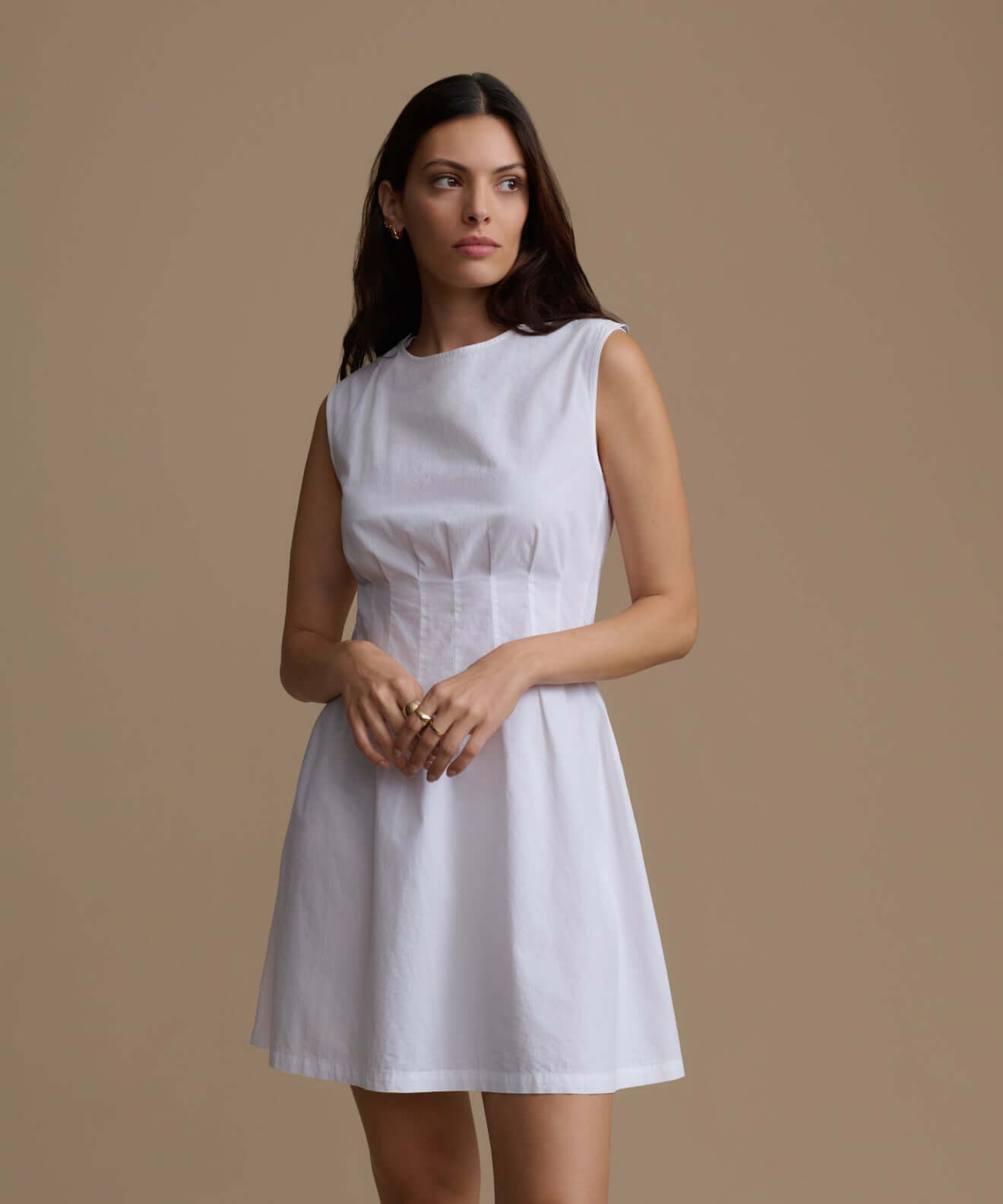 White sleeveless dress featured in the Dresses collection, showcasing a stylish and elegant design.